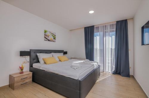 Ένα ή περισσότερα κρεβάτια σε δωμάτιο στο Apartment Villa Cecilia