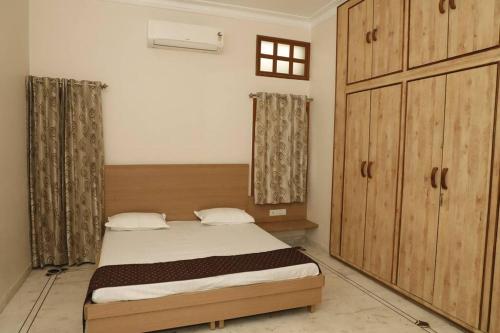 Postel nebo postele na pokoji v ubytování Medhya Boutique Homestay