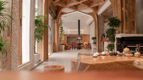 a large room with a piano in the middle of a building at Patio Spring Holiday Inn -- Free round trip pick-up service --Panoramic view of Tianmen Mount in Zhangjiajie