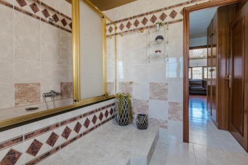 a bathroom with a shower and a sink at Villa Rural Avril in Camarles