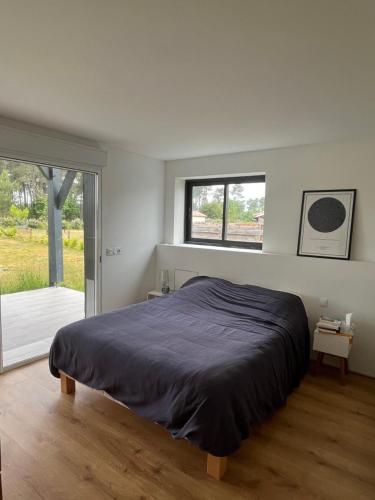 Postel nebo postele na pokoji v ubytování Maison chaleureuse entre pins et ocean