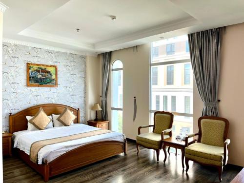 Postel nebo postele na pokoji v ubytování Madella Hotel