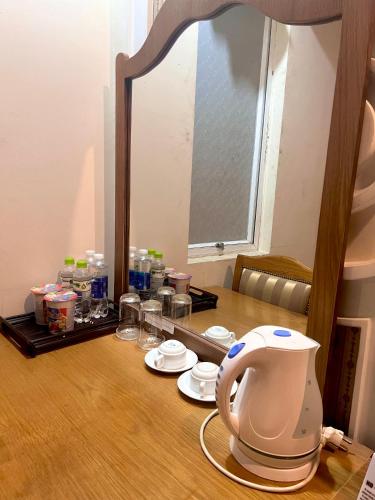a mirror sitting on top of a table at Madella Hotel in Can Tho