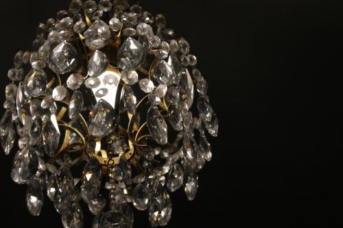 a close up of a chandelier with diamonds at Alp Art Hotel Götzens in Innsbruck