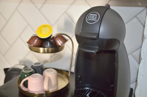 a coffee maker sitting on top of a counter at V62 studio apartments- Downtown Sopron in Sopron