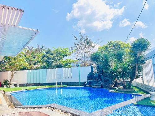 a large swimming pool in front of a building at B&H Villa - Villa has swimming pool in Lang Co