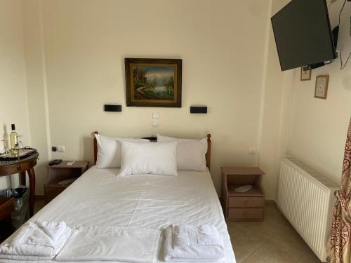 Ένα ή περισσότερα κρεβάτια σε δωμάτιο στο Vervekis Apartments