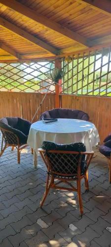 a table and two chairs in a pavilion at Chatka in Stegienka