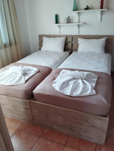 two beds sitting next to each other in a room at Villa Olga in Pefkari