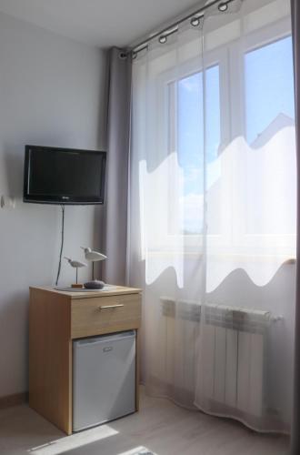 TV a/nebo společenská místnost v ubytování Szafir Ustka