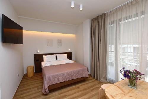 Ένα ή περισσότερα κρεβάτια σε δωμάτιο στο LOCAL SUITES - Nea Moudania Chalkidiki