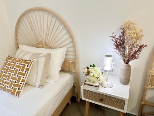 a bedroom with a bed and a nightstand with a lamp at Como Charme Apartment in Como