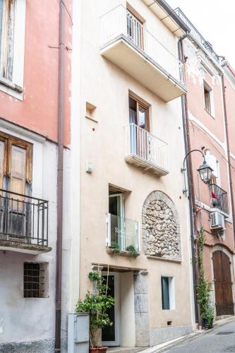 a building with balconies on a city street at Casetta Vacanze in Frasso Telesino