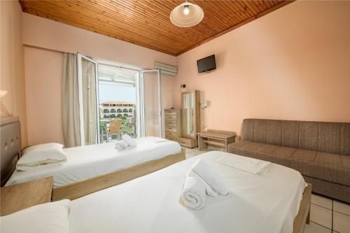 Postel nebo postele na pokoji v ubytování APHRODITE APARTMENTS