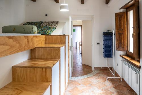 a small room with a bunk bed and a hallway at Casetta Vacanze in Frasso Telesino