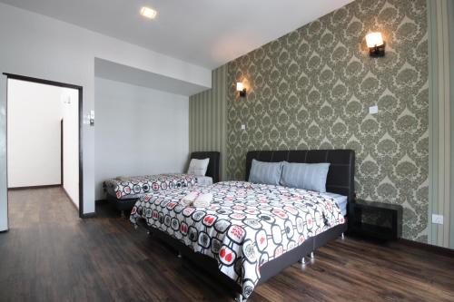 a bedroom with two beds and a wall at Shamrock Beach Villas 15 Seaview in George Town