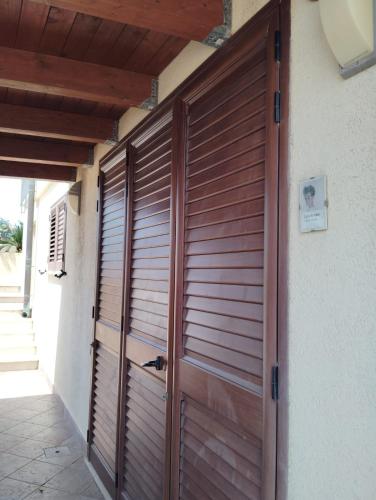a wooden door of a house with at Raggi di Sole in Custonaci