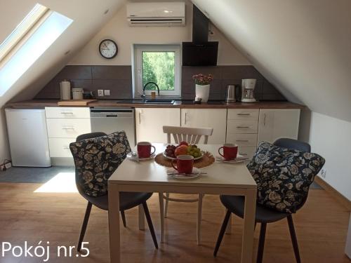 Kuchyňa alebo kuchynka v ubytovaní Apartamenty i Pokoje u Doroty