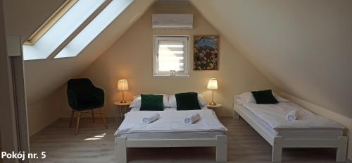 Posteľ alebo postele v izbe v ubytovaní Apartamenty i Pokoje u Doroty