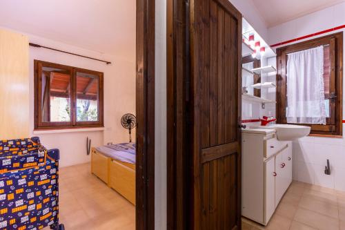 a bathroom with a sink and a toilet in a room at Holiday Home Le Sirene in Fort Village