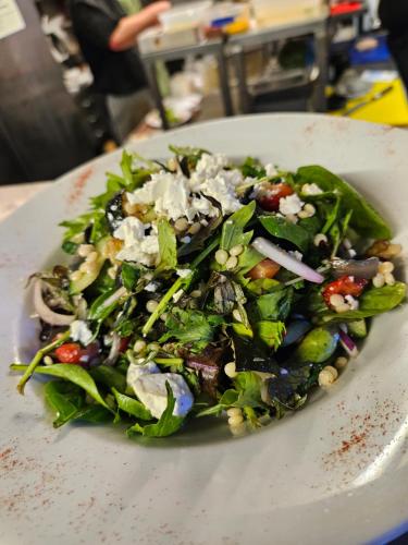 a salad on a white plate on a table at The Blue Bell Inn in Weaverthorpe