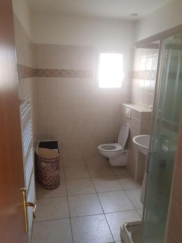 a bathroom with a toilet and a sink at Loue studio in Corte
