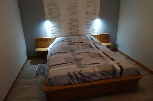a bedroom with a bed in a room with a window at Le domaine du Clair Mont entre Beauval et châteaux in Monthou-sur-Cher
