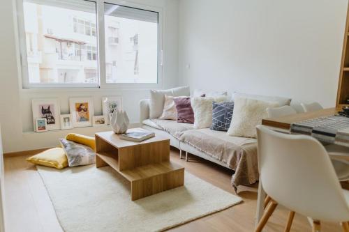 a living room with a couch and a table at Artistry Apartment in Komotini