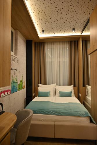 a bedroom with a large bed in a room at Rina Apartments in Sarajevo