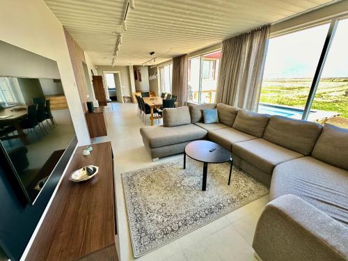 a living room with a couch and a table at Hrossholt in Stykkishólmur