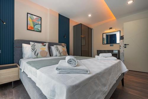 Katil atau katil-katil dalam bilik di Doqu Suites Hotel