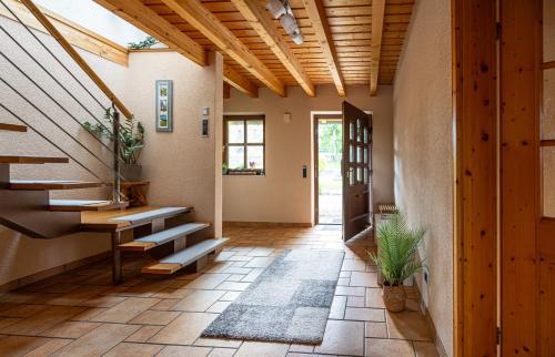 an open hallway with stairs and a door at Wellnessparadies mit Sauna und Whirlpool in Krakow am See