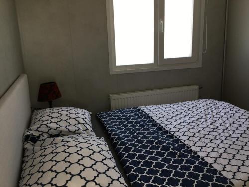 Ένα ή περισσότερα κρεβάτια σε δωμάτιο στο Chalet Buitenhof 45A