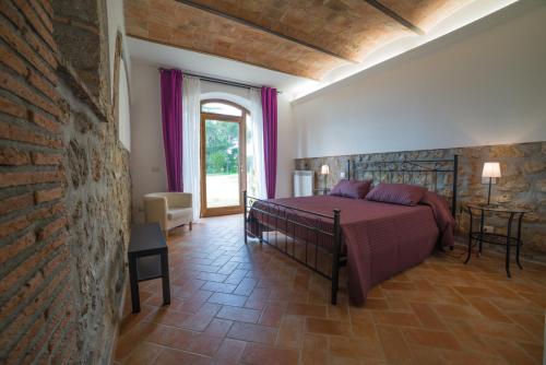 Postel nebo postele na pokoji v ubytování Agriturismo Sensi