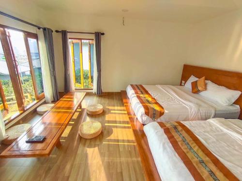 Postel nebo postele na pokoji v ubytování Chenfong Rakthai Resort-ไร่ชาเฉินฟงรีสอร์ท