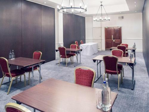 a conference room with tables and chairs and a table at The Grand Bristol By Sunday in Bristol