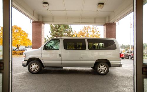 a white van parked inside of a garage at Coast Hilltop Inn in Pullman