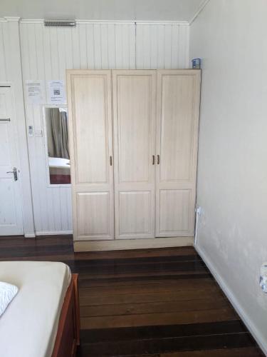 a bedroom with white cabinets and a bed in it at Brookville in Georgetown