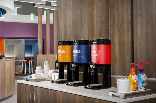 a counter with bottles of wine and drinks on it at Tru by Hilton Jacksonville West I 295 in Jacksonville