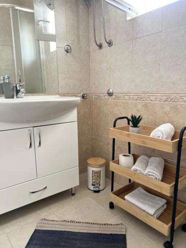 a bathroom with a sink and a mirror at Apartments Mrdak in Bar