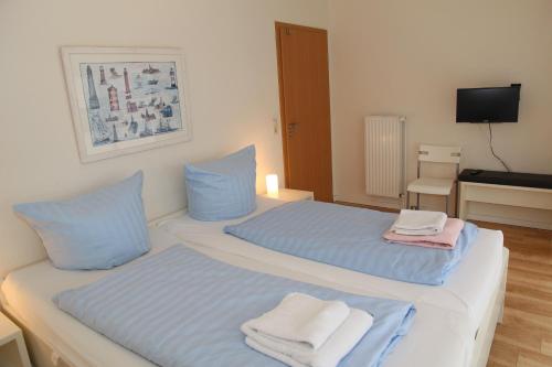 Ένα ή περισσότερα κρεβάτια σε δωμάτιο στο Friesennest