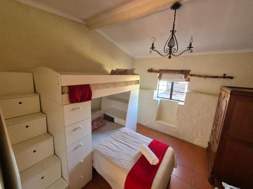 a bedroom with a bunk bed and a window at Ganora Guest Farm, Camping and Excursions in Nieu-Bethesda