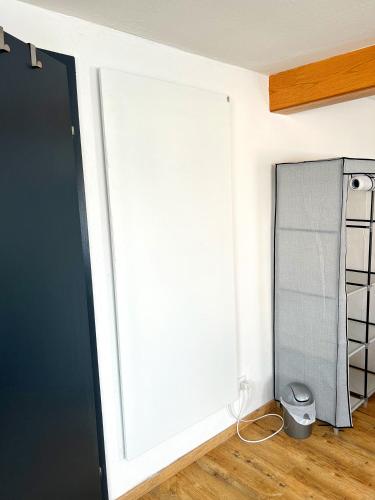 a sliding door in a room with a closet at Gemse-Schneiders Wohnen auf dem Bauernhof in Schollbrunn