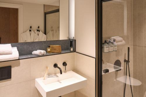 a bathroom with a sink and a mirror at The Store in Oxford