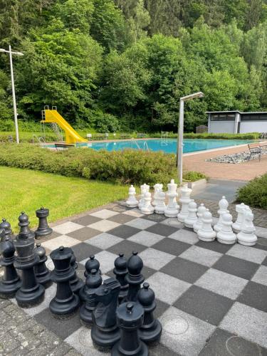 a chess board with a giant chessboardigun at Bergstadt Apartment Lautenthal ,Modern, Stylisch, Geräumig in Lautenthal