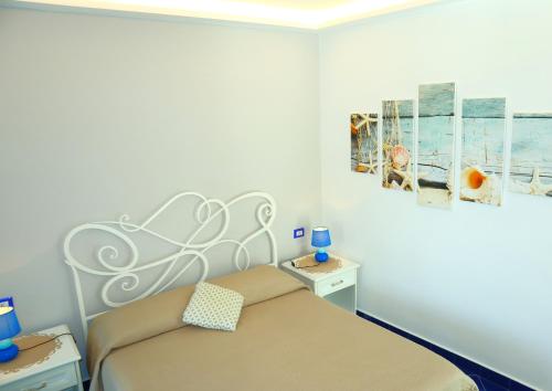 Letto o letti in una camera di Santa Margherita Suite - CHIAIOLELLA