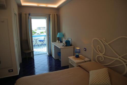 Letto o letti in una camera di Santa Margherita Suite - CHIAIOLELLA