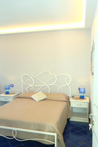Letto o letti in una camera di Santa Margherita Suite - CHIAIOLELLA