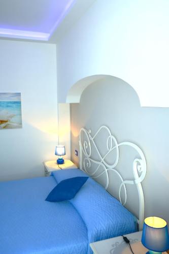 Letto o letti in una camera di Santa Margherita Suite - CHIAIOLELLA