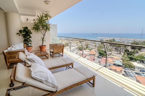 a balcony with a view of the ocean at Amazing Sea and Marina View City Center 2BDR Flat in Larnaka
